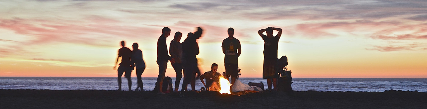 Group of youth around campfire